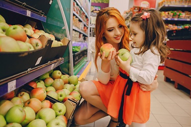 Woman and child buying fruit